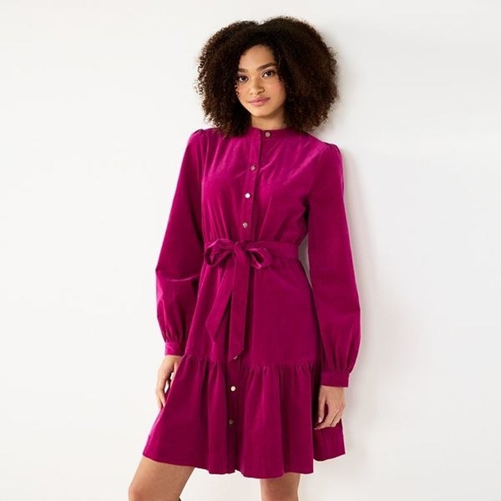 model wearing a magenta button down shirt dress