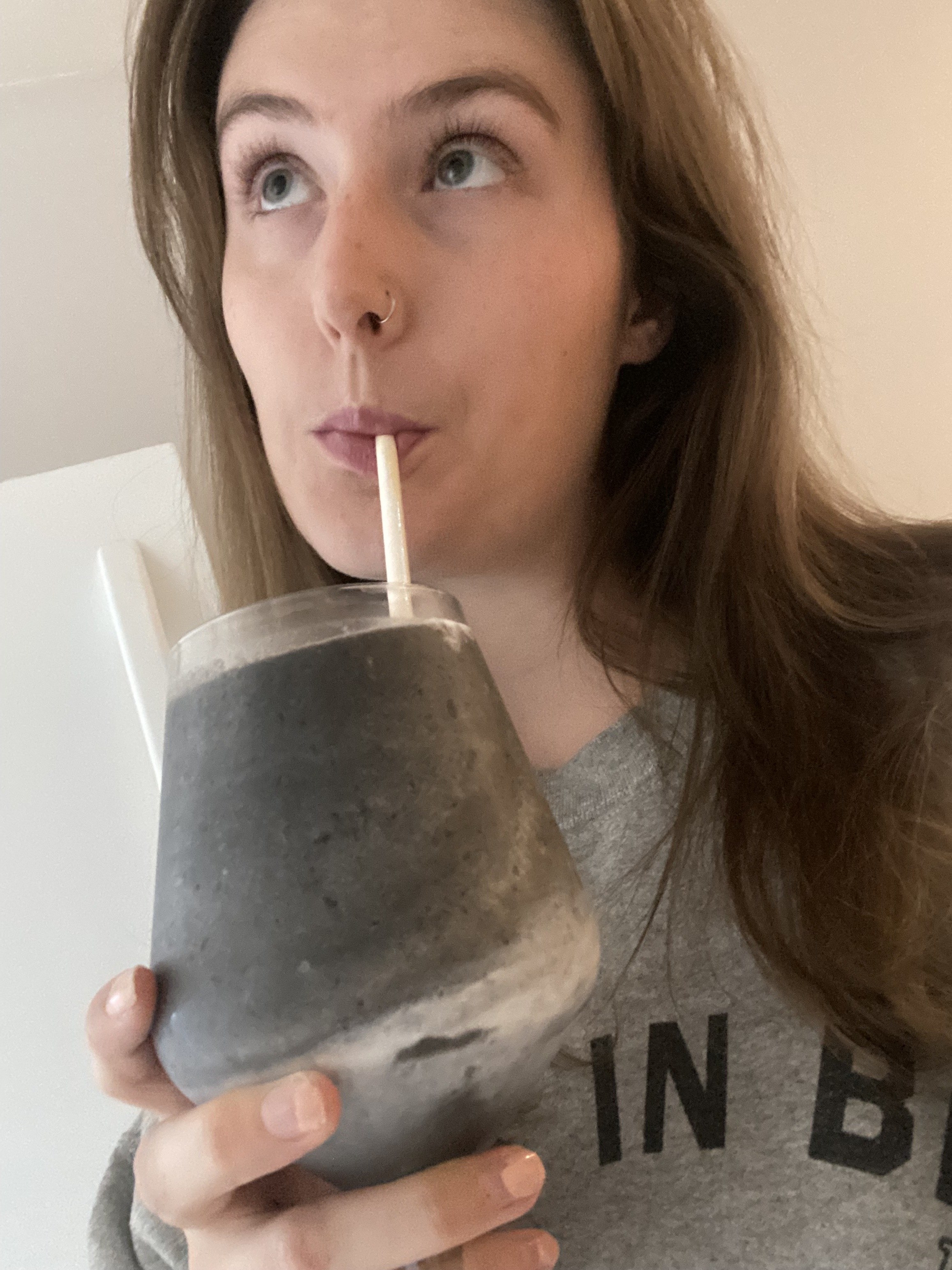 The writer drinking her smoothie