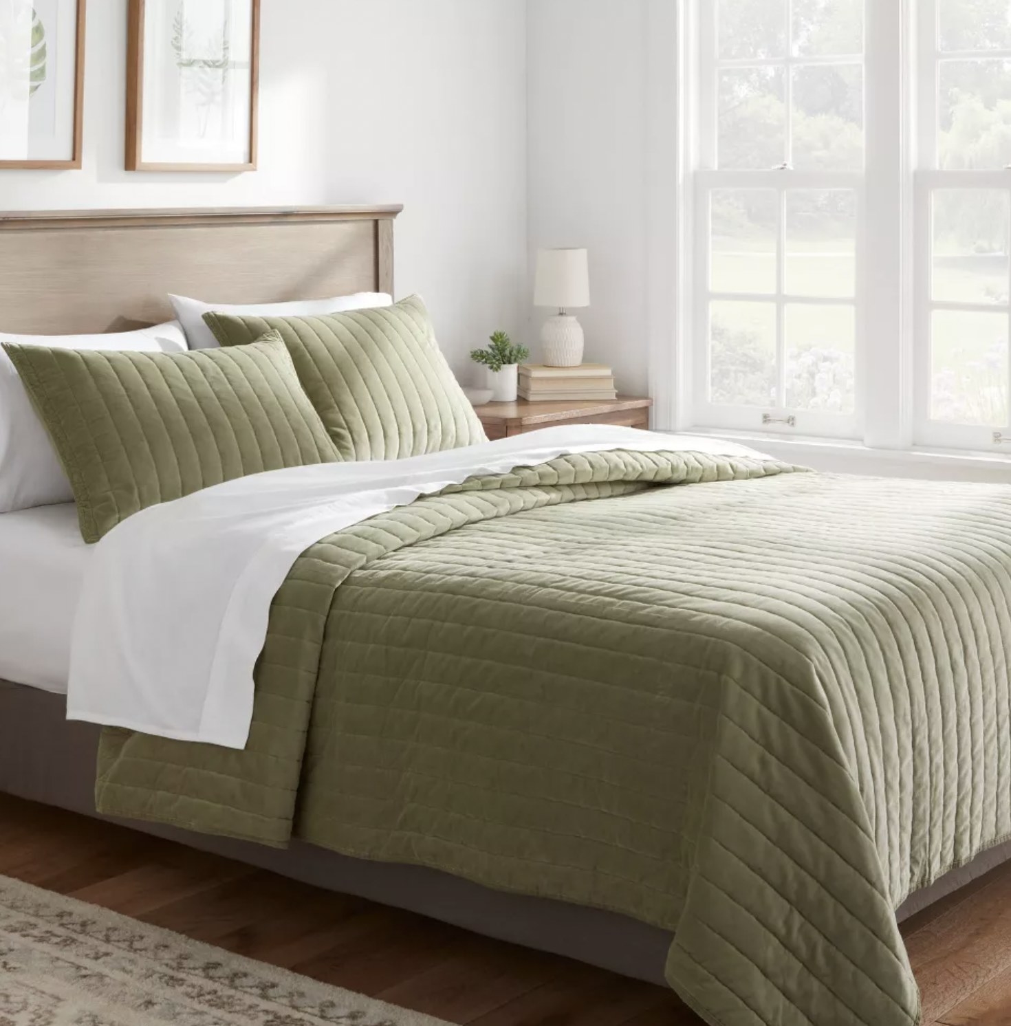 The green quilt on bed