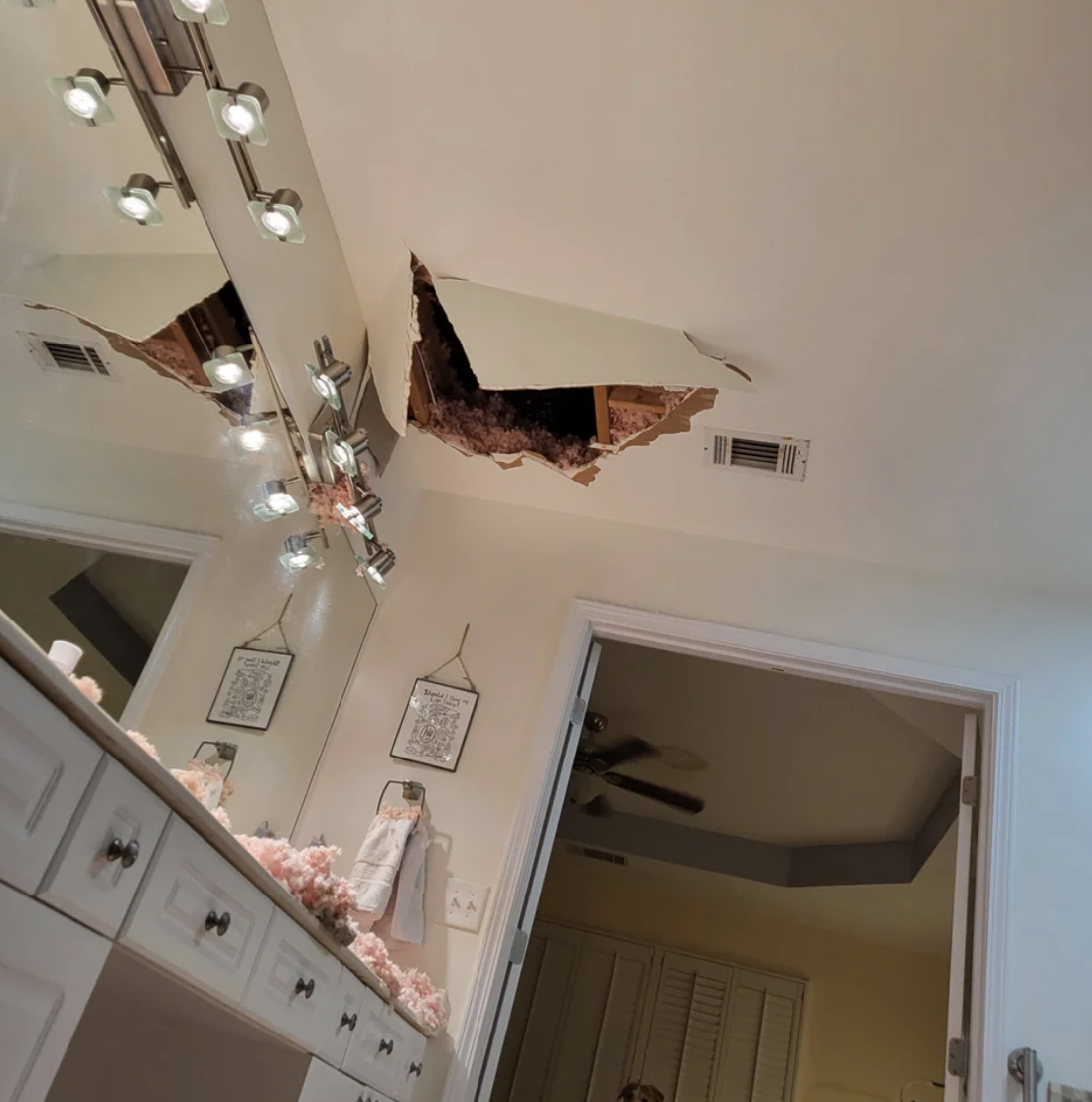 huge hole in the bathroom ceiling