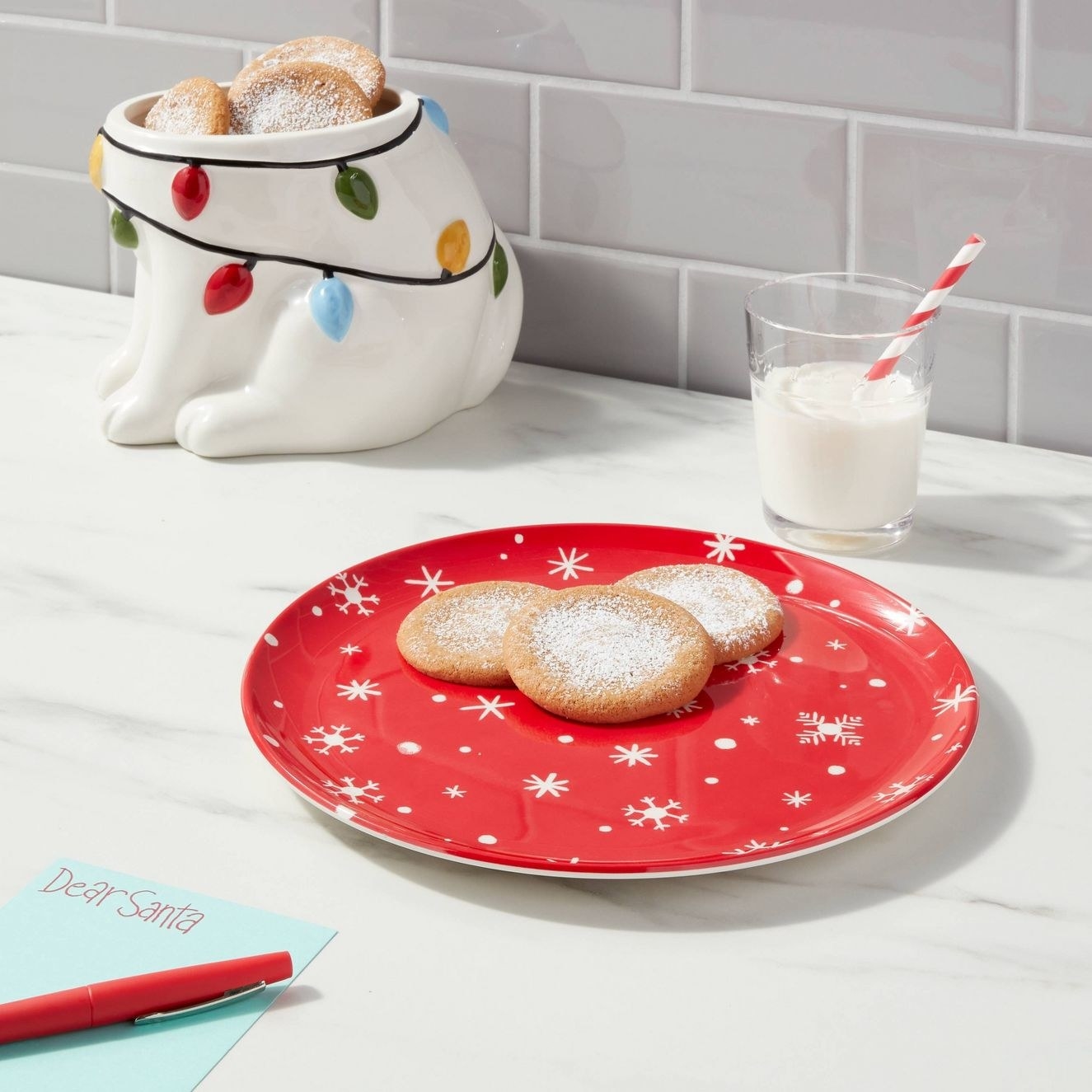 The red plate with a snowflake design styled with cookies on top
