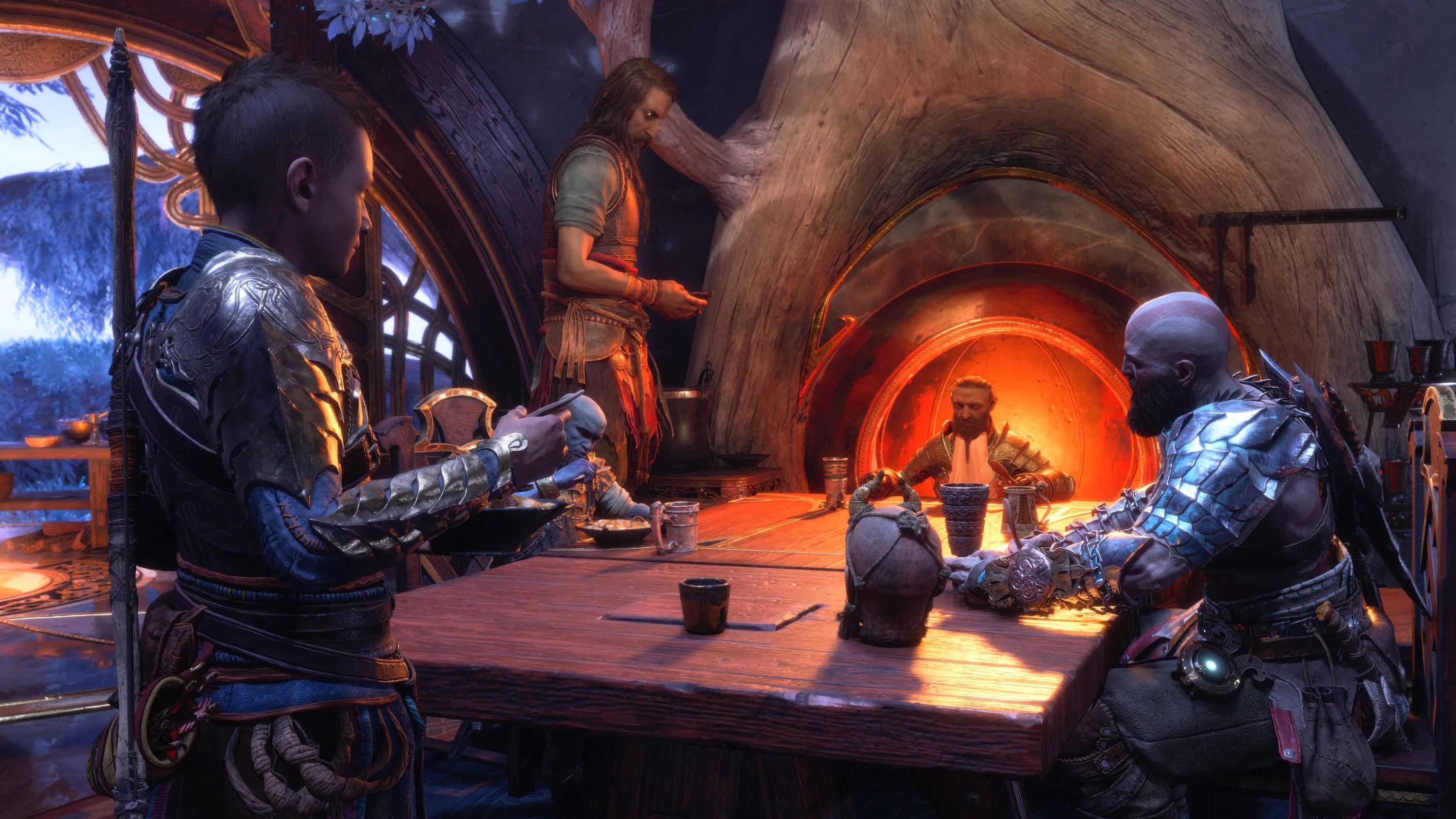 A boy in armor, a blue dwarf, a tall man, a tan dwarf, a bald man in leather armor, and a disembodied head gather for a meal at a table in front of a fireplace