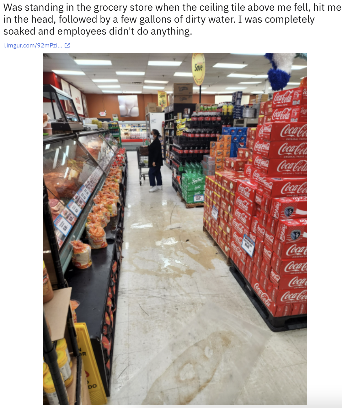 the dirty water on the floor of the grocery aisle