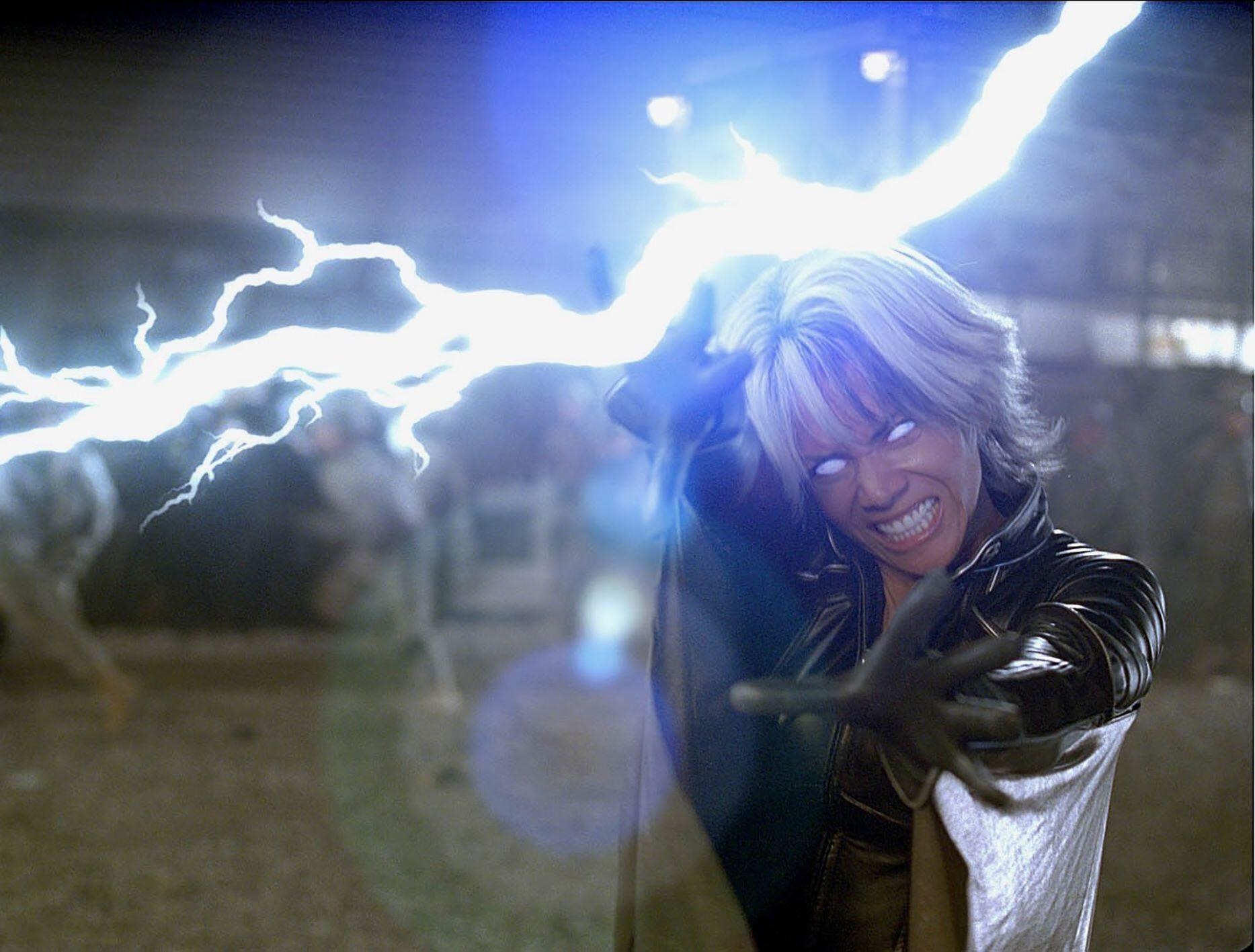 A woman with an ornate leather cape and white hair summons lightning from the sky