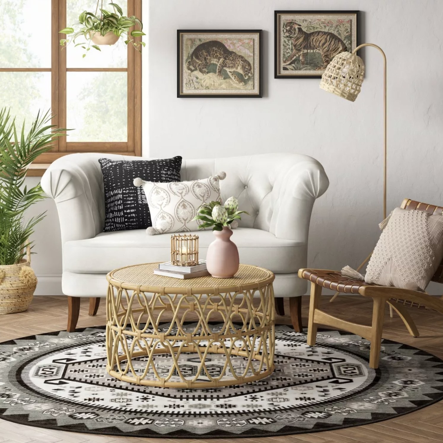 The patterned area rug underneath boho coffee table