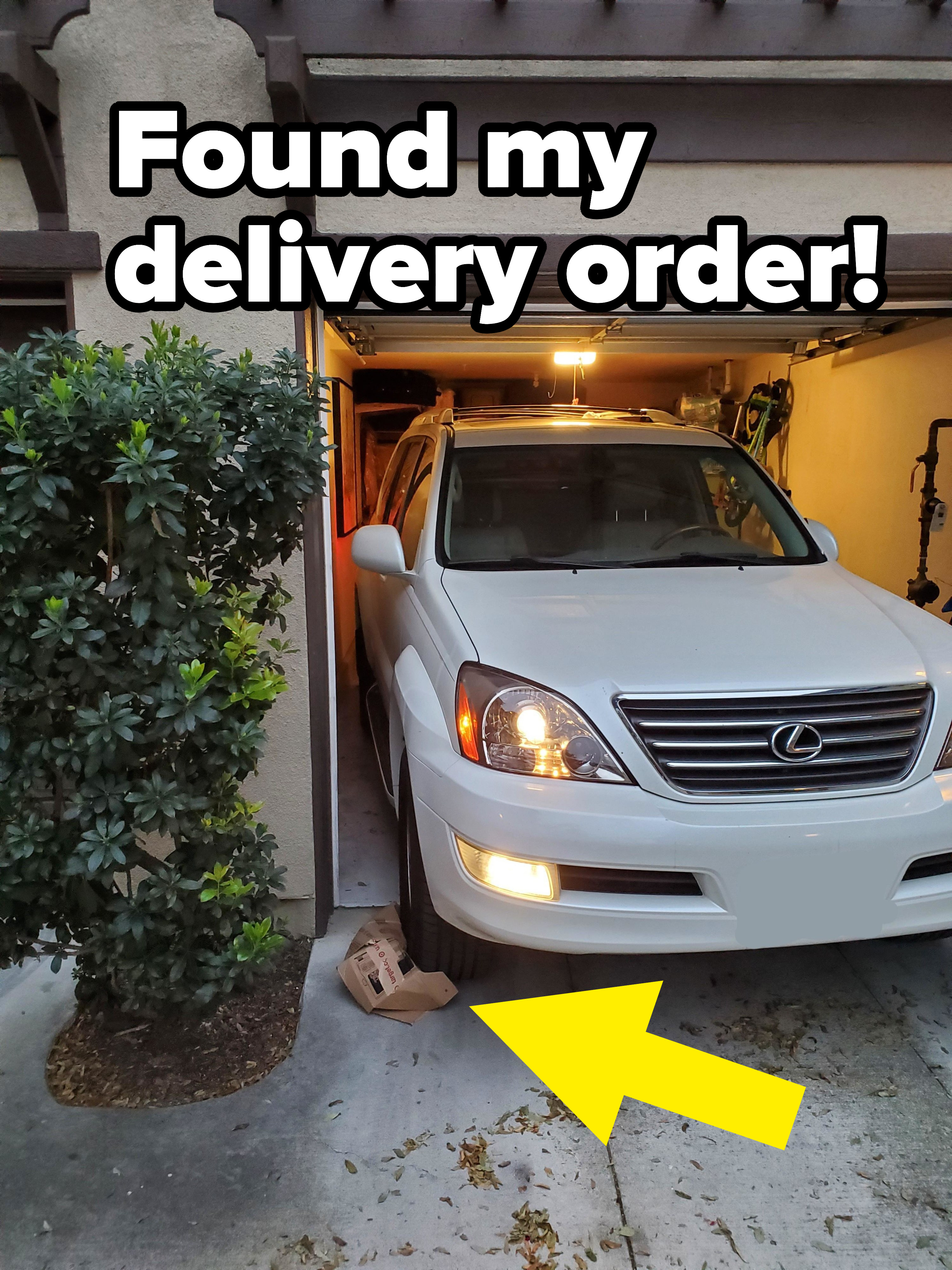 A delivery package under a car tire