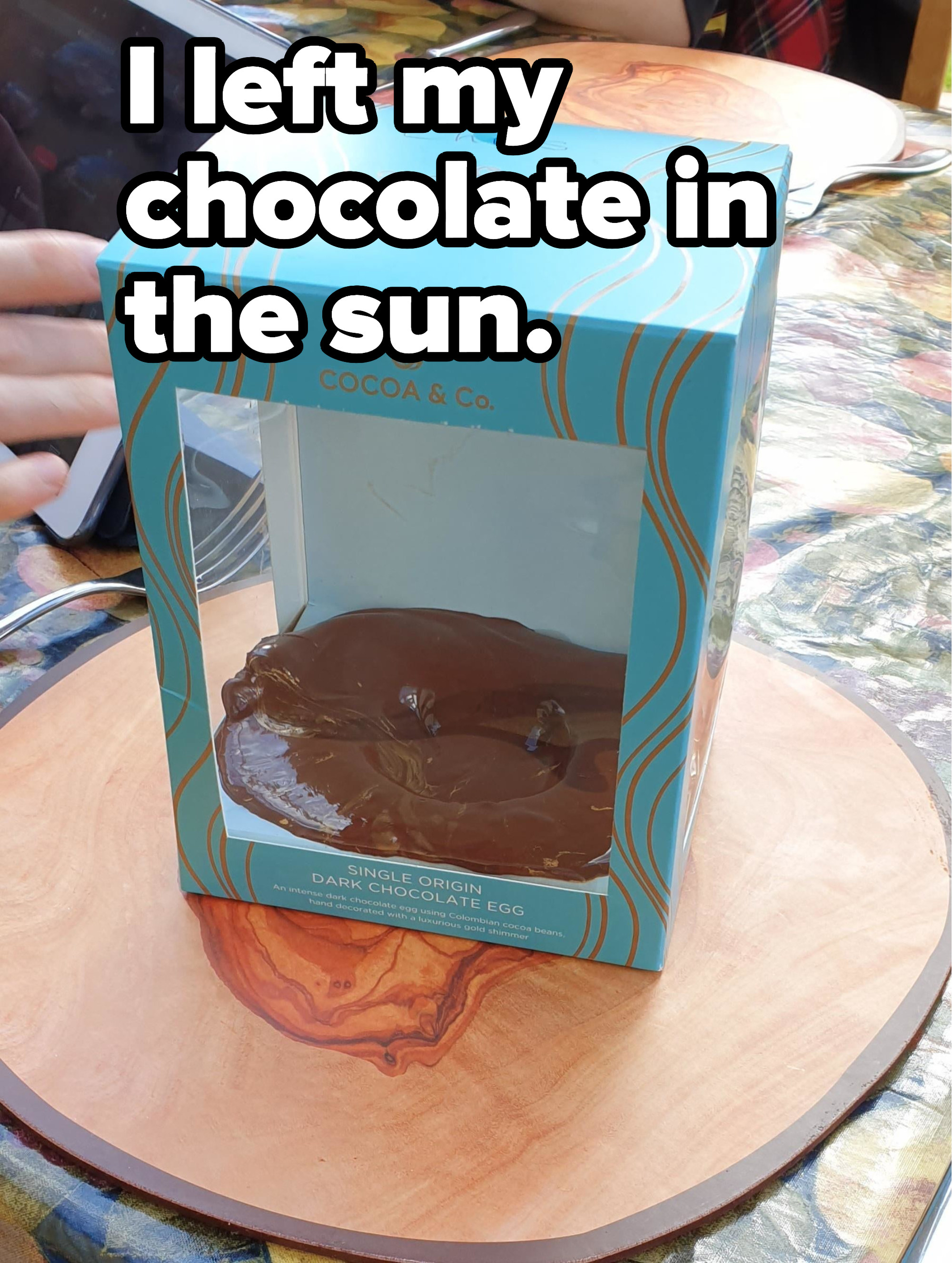 A melted chocolate egg in a box left in the sun