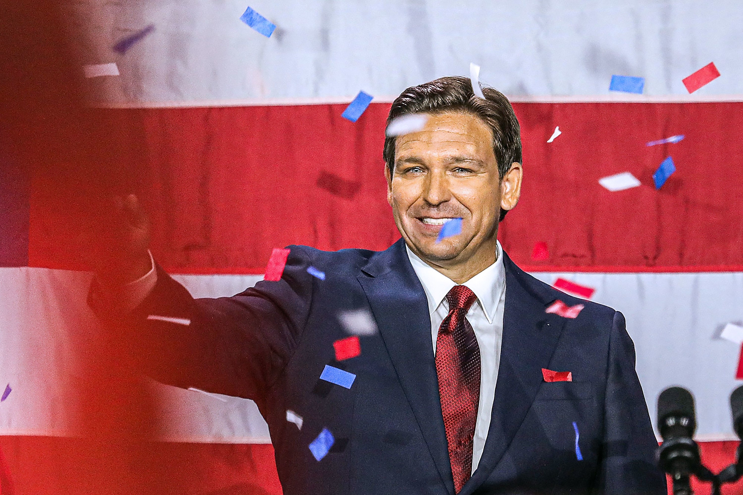DeSantis showered in confetti standing in front of the US flag