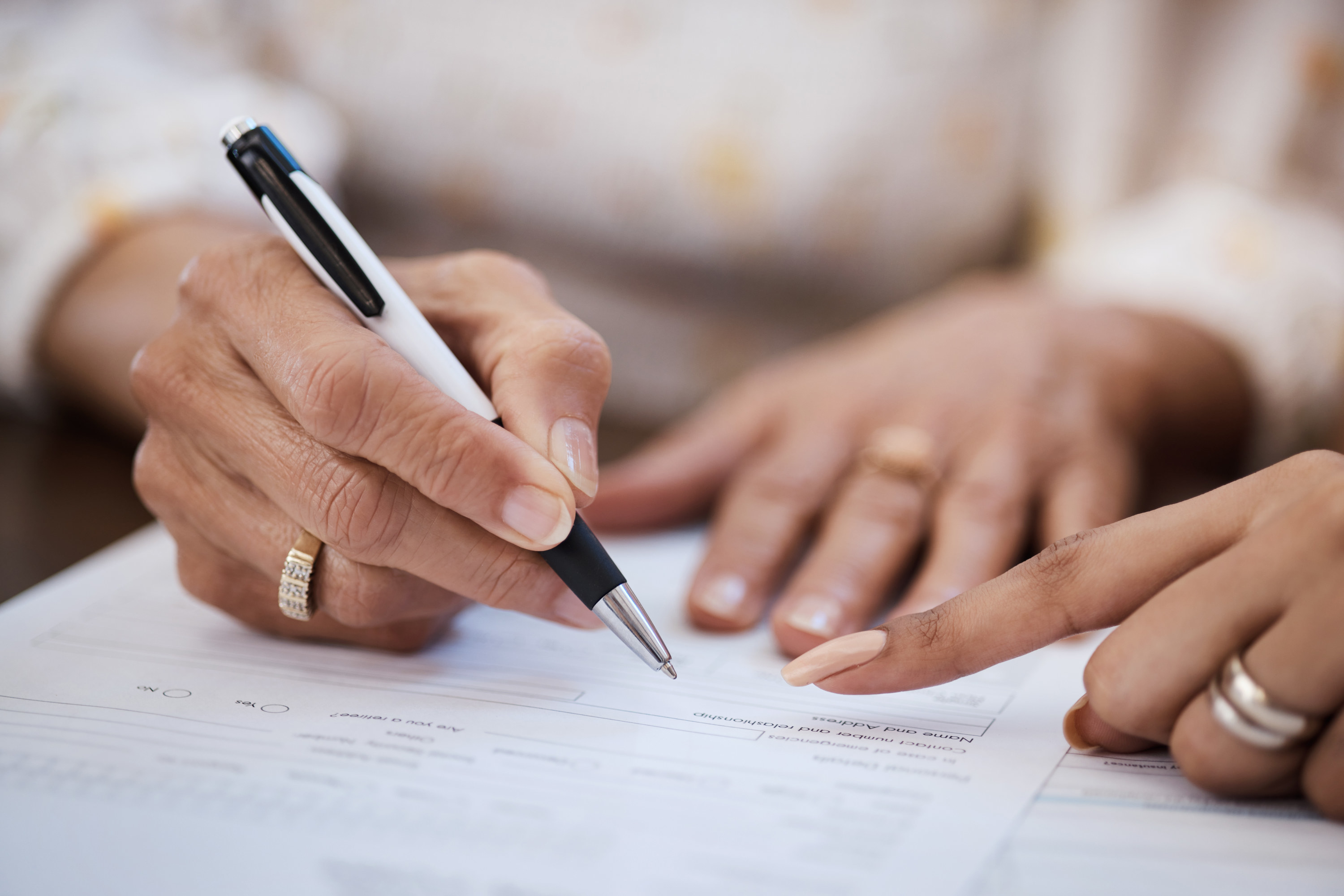 a couple signing a document