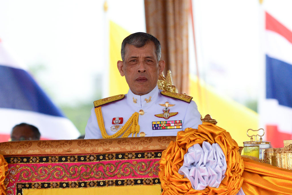 King Vajiralongkorn standing at a podium