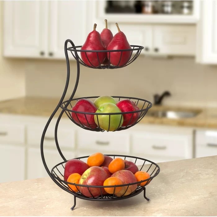Black fruit bowl with fruit in it