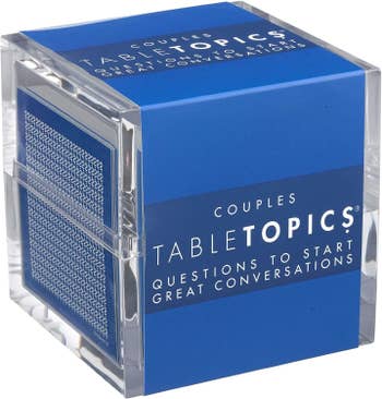 a blue cube of table topics for couples