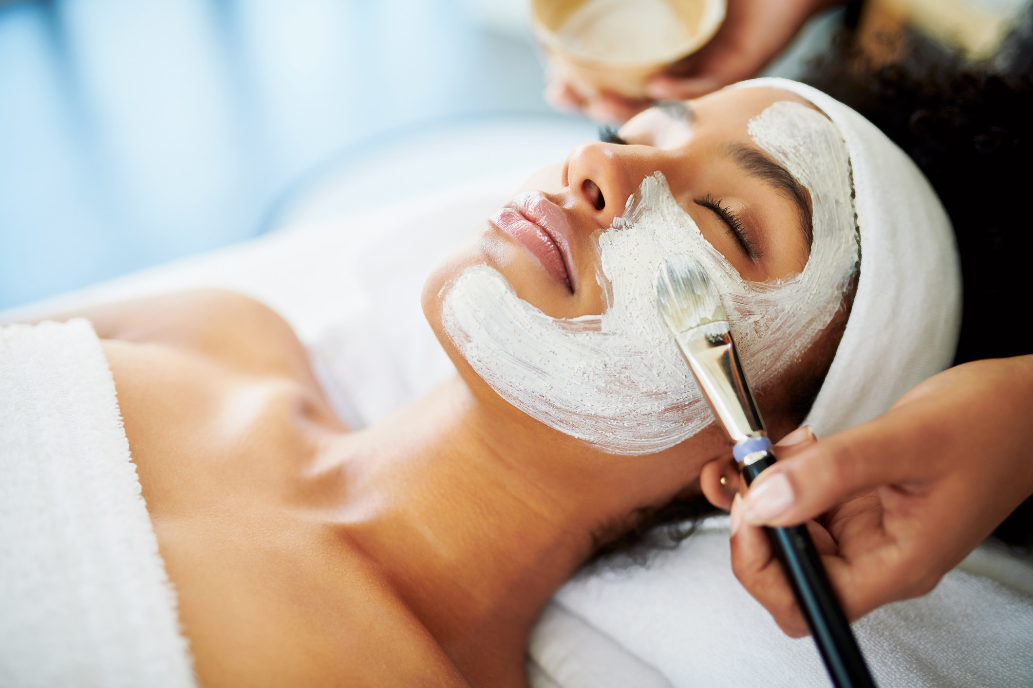 Woman getting a facial at a spa