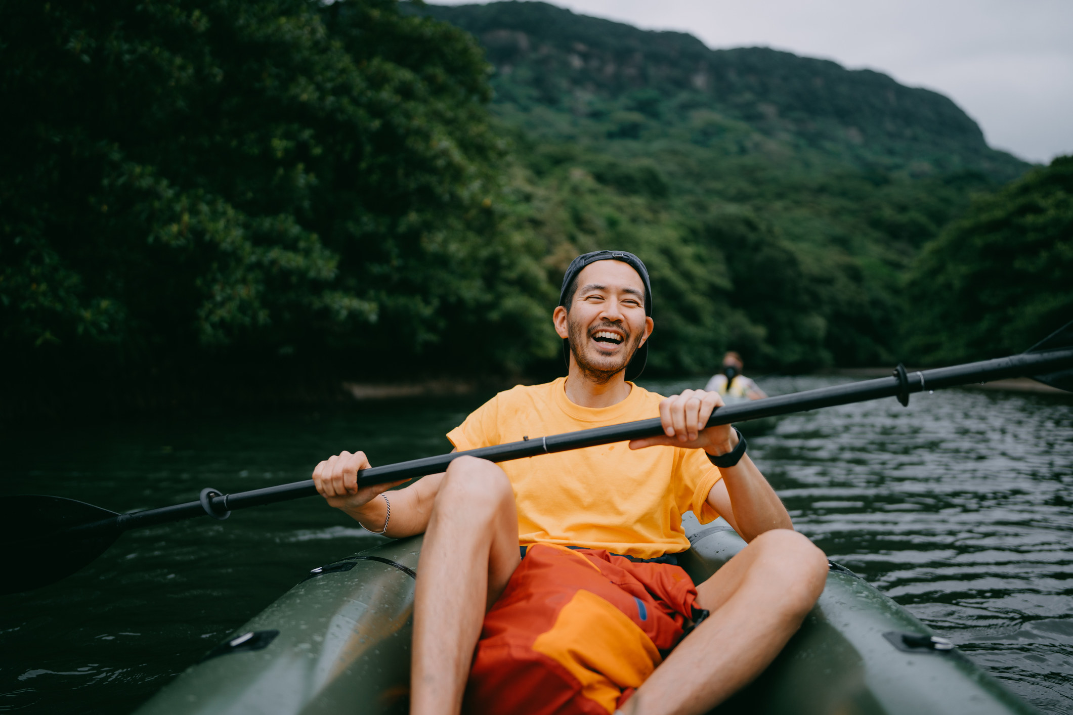 Man laughing in kayak