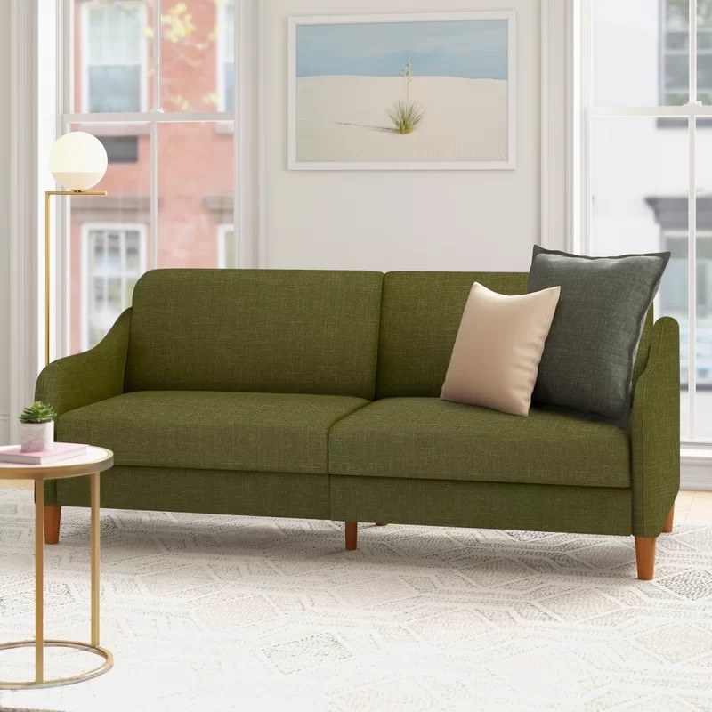 the olive green sofa