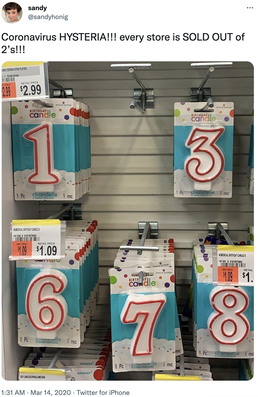 coronavirus hysteria, every store is sold out of 2&#x27;s and a photo showing numeral candles with the 2 section empty
