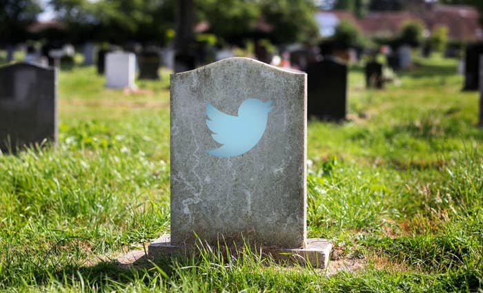a tombstone with a Twitter icon on it