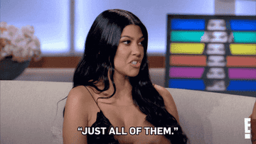 Kourtney Kardashian waving her hands and saying just all of them