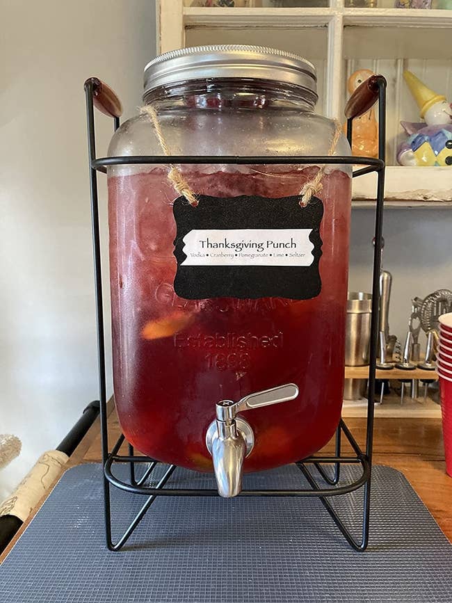 Reviewer's drink dispenser filled with a red punch