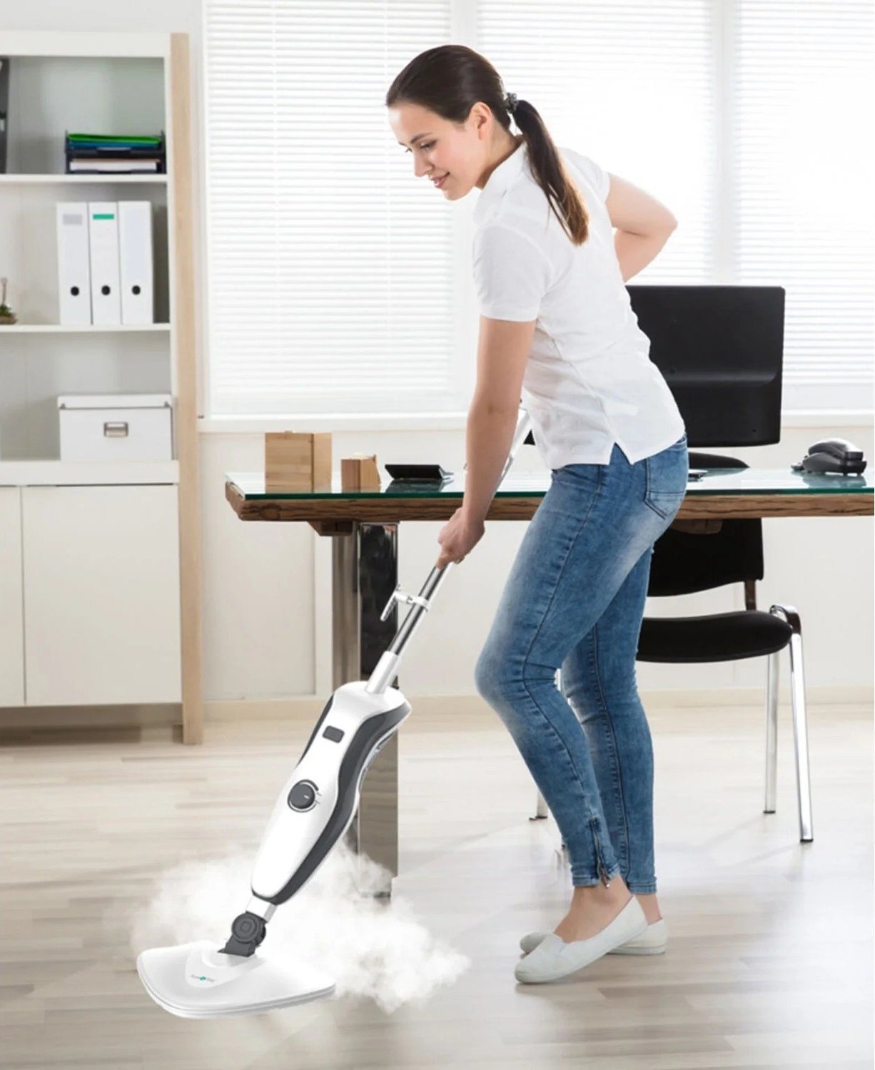 a model using the steam mop to clean the floor