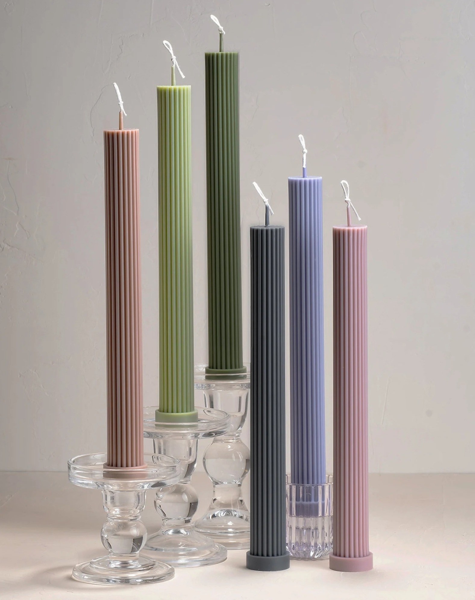 A variety of the candles are shown in different colors