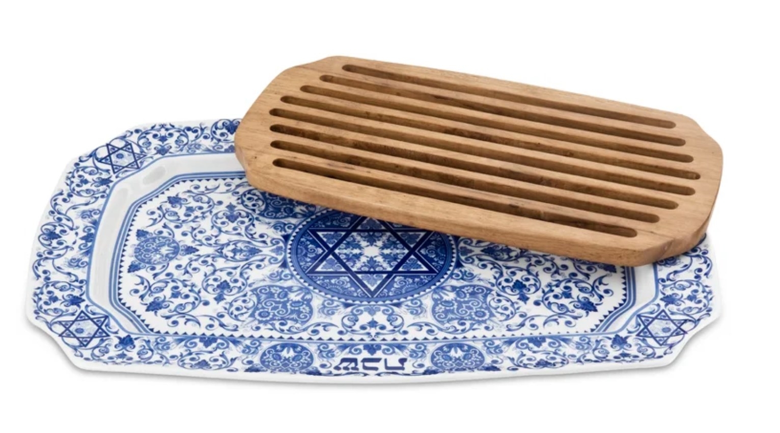 The blue and white porcelain tray has very intricate detailing including a Jewish star and a wooden bread catcher panel