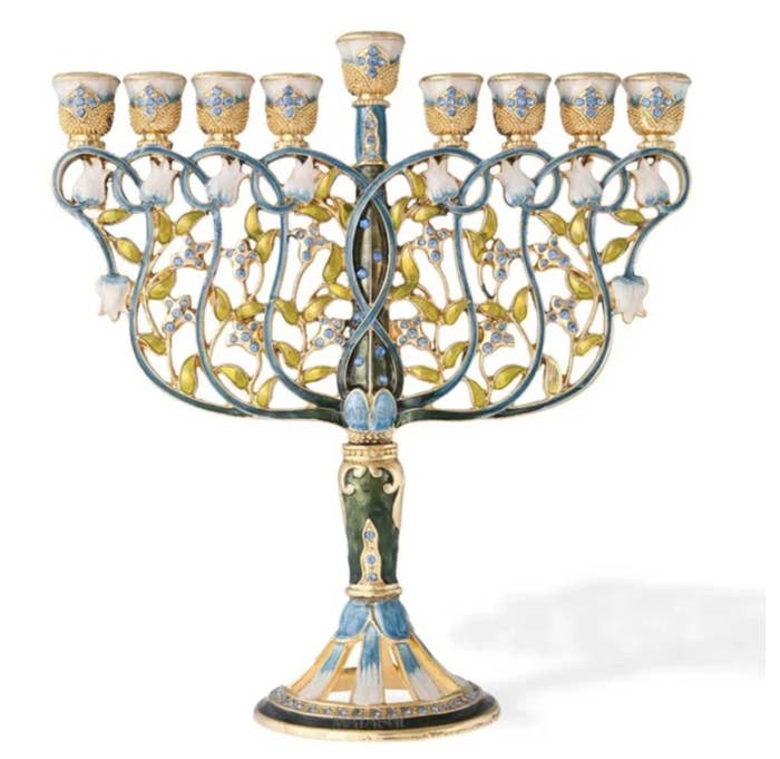 The blue and gold menorah has flowery detailing