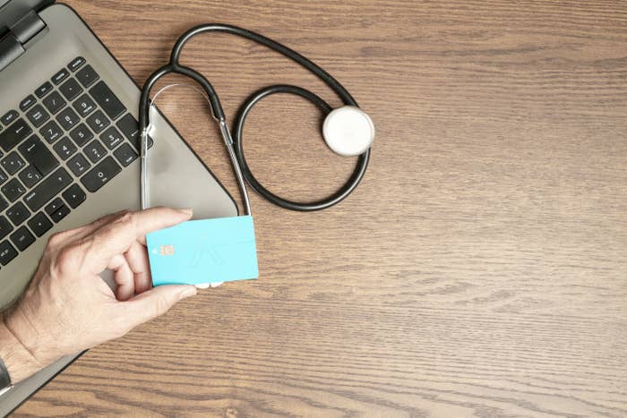 Stethoscope, credit card and laptop.