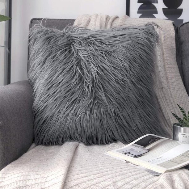 gray faux pillow on a chair