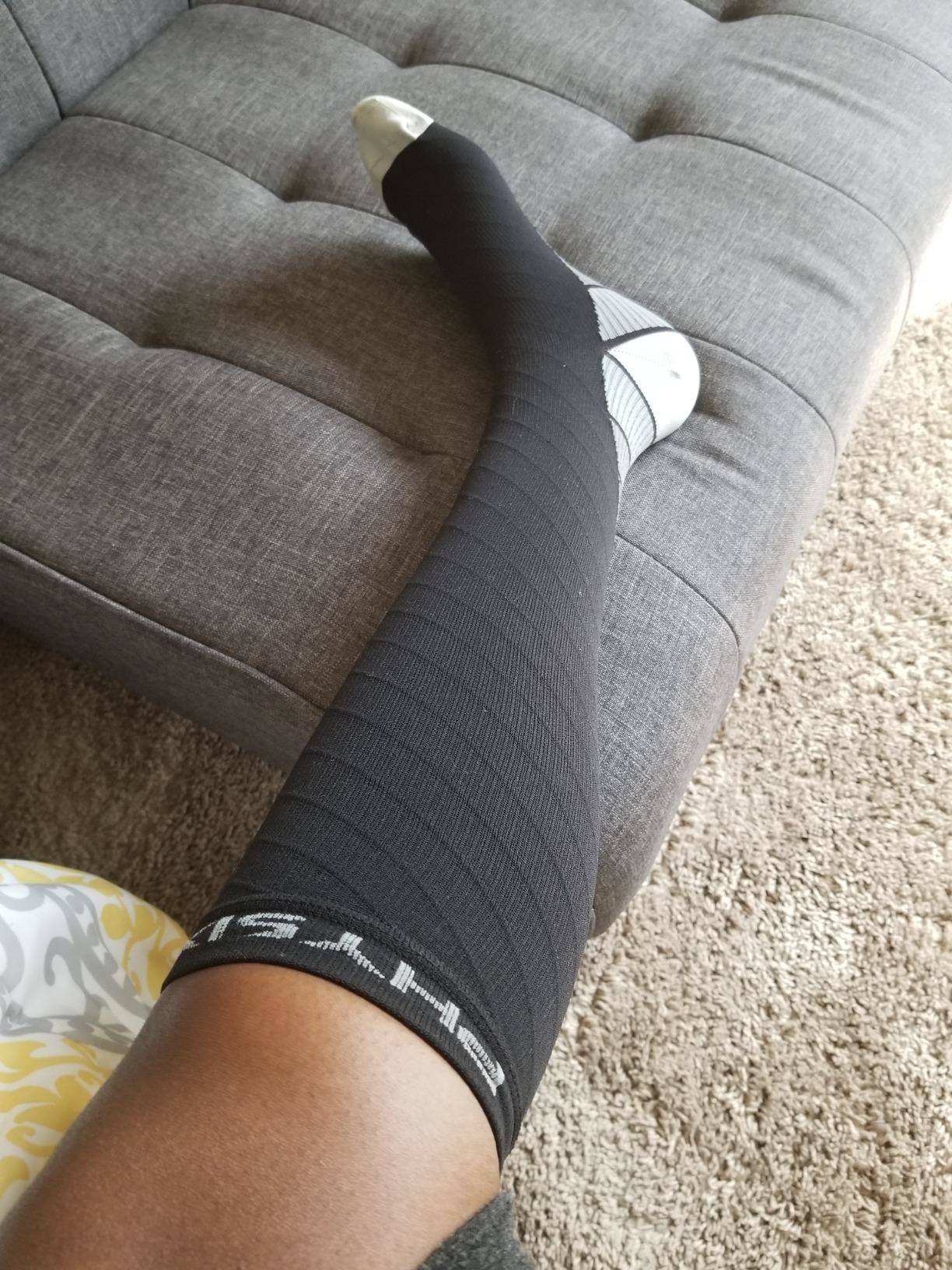 reviewer photo of gray compression sock