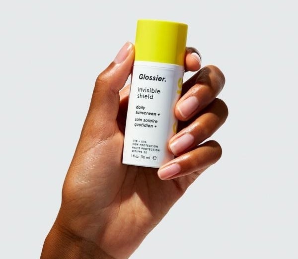 hand holding Glossier invisible Shield