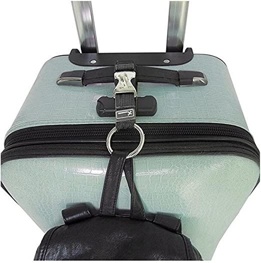 black luggage strap attached to a green suitcase