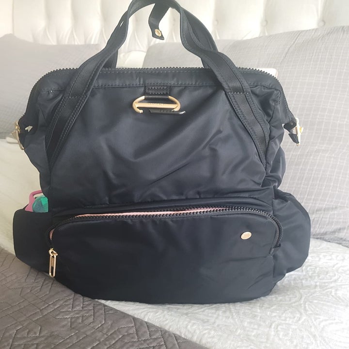 reviewer photo of black anti-theft backpack