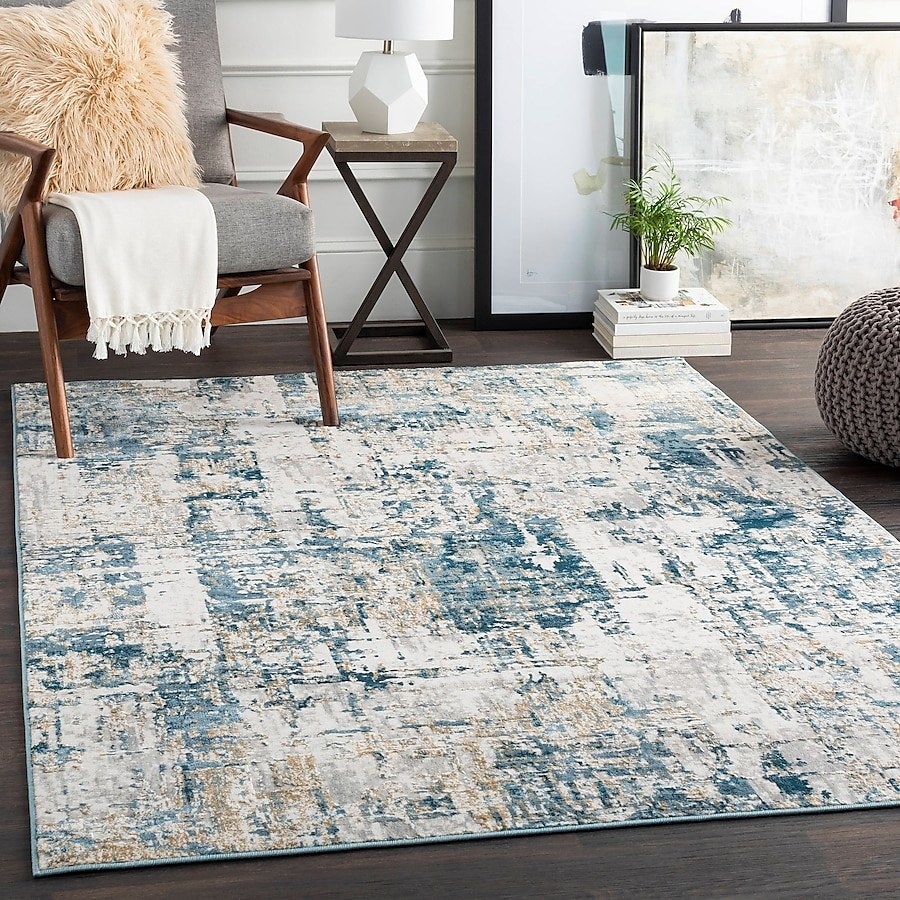 The modern area rug on the floor in a living room