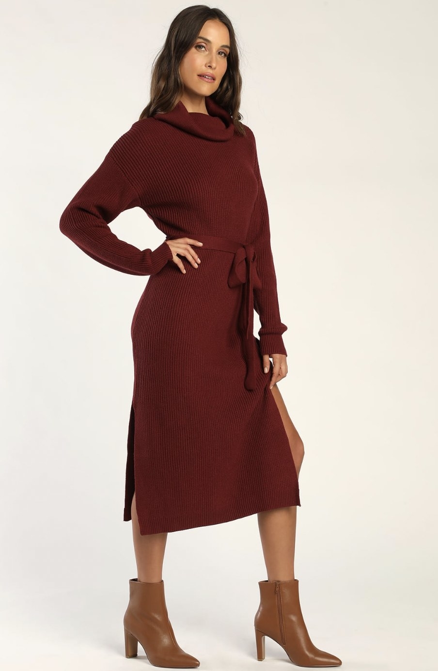 Model standing in the burgundy dress with brown ankle boots