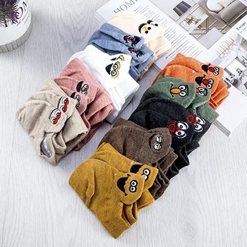 ten pairs of the folded expressive socks in different colors