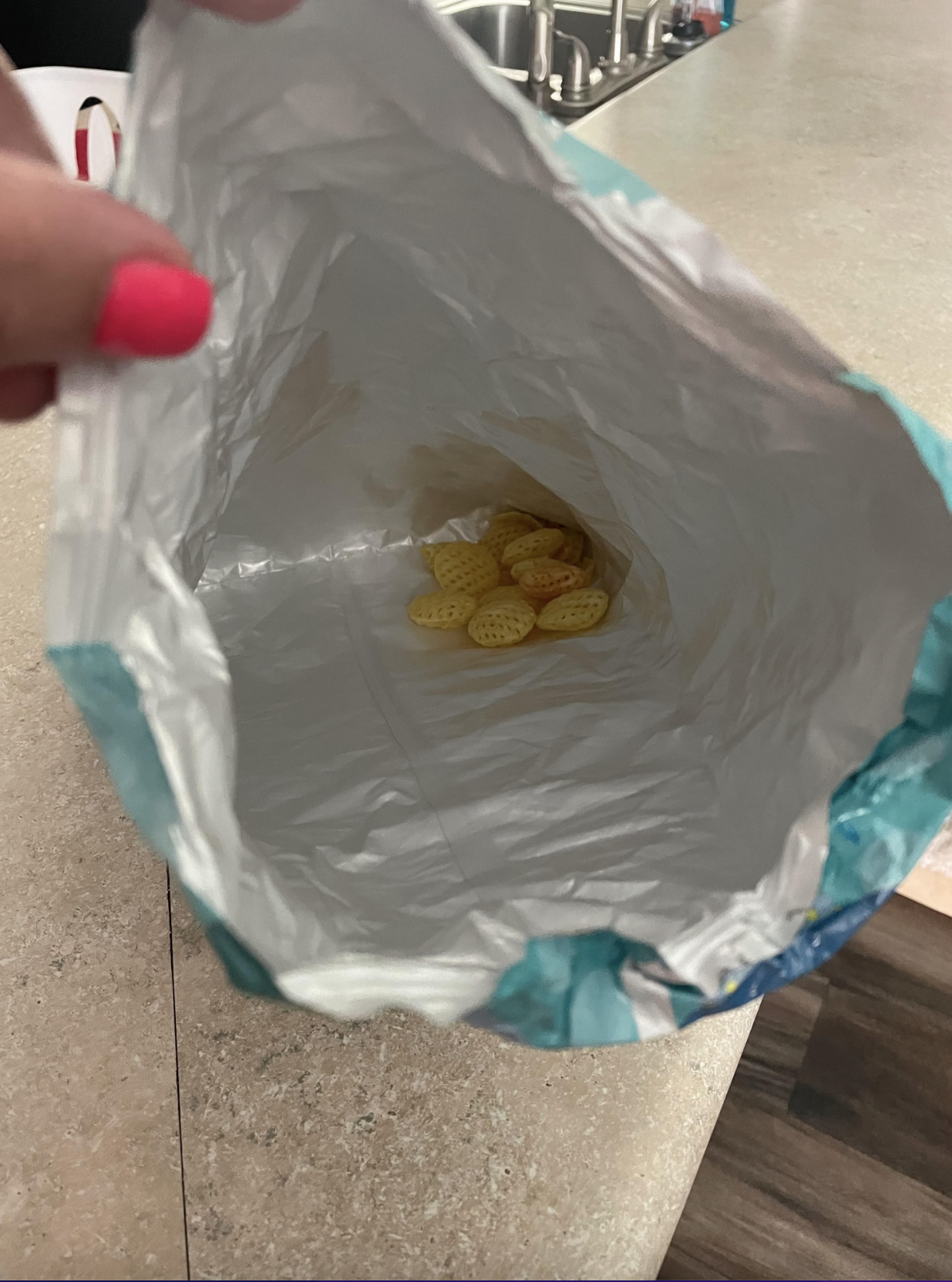A large, empty snack bag except for a few crumbs at the bottom, with the caption, &quot;My boyfriend&#x27;s solution to me being mad that he finishes everything in the house without buying a replacement&quot;