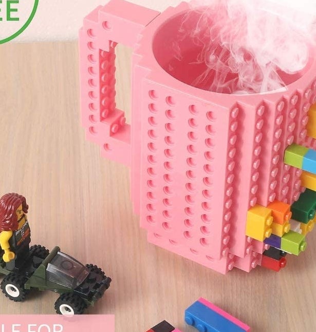 the cup with steam coming out of it and building block pieces on it