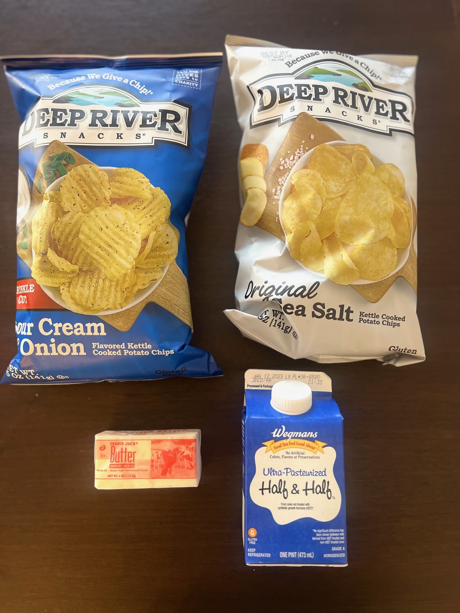 Bags of potato chips, cream, and butter.