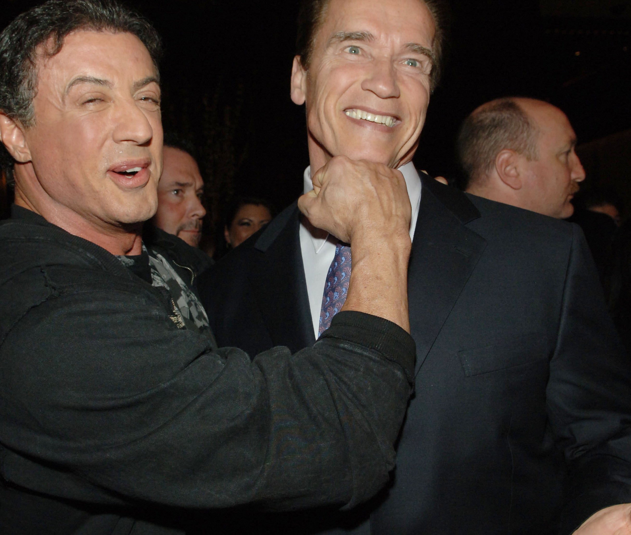 Sylvester jokingly punches Arnold under the chin