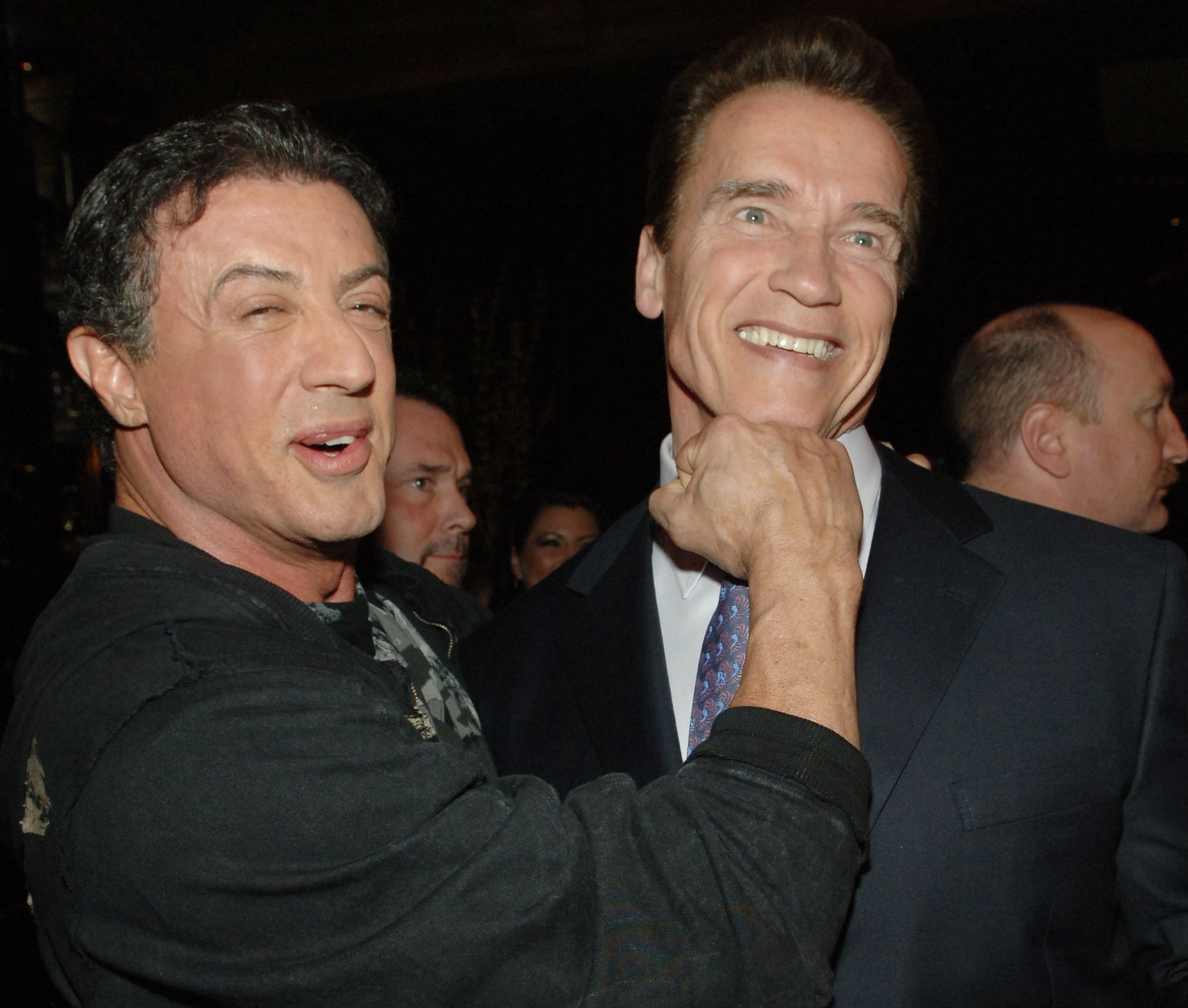 Sylvester jokingly punches Arnold under the chin