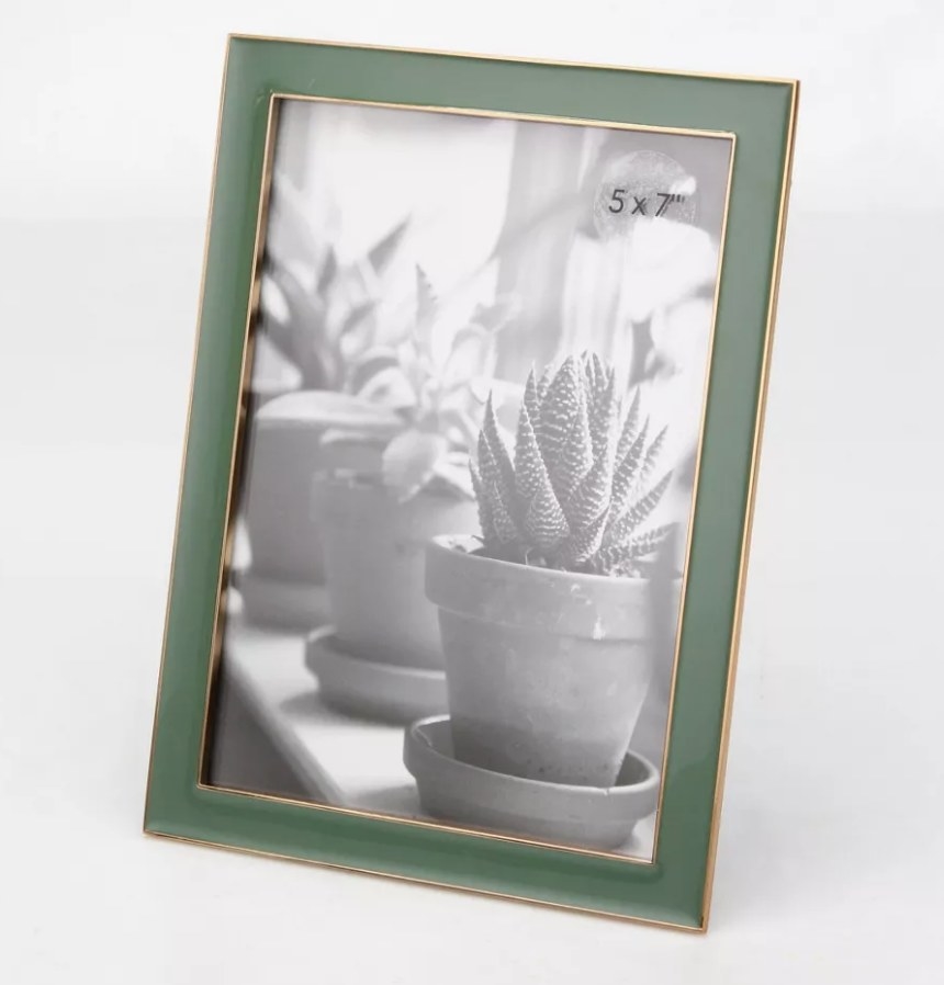 A green and gold picture frame