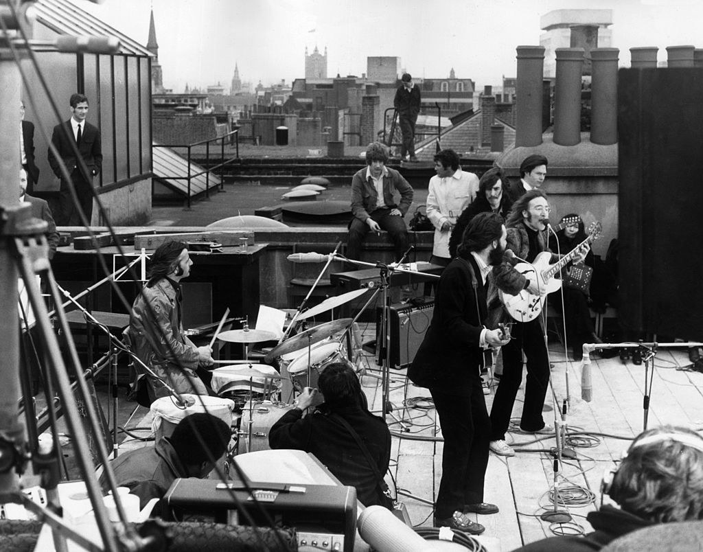 The Beatles performing on the roof