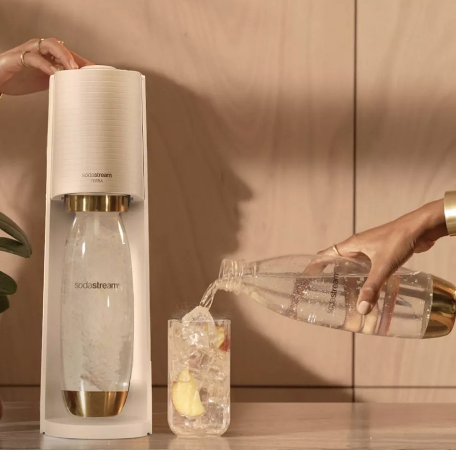 A white and gold sodastream