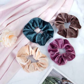four colorful velvet scrunchies