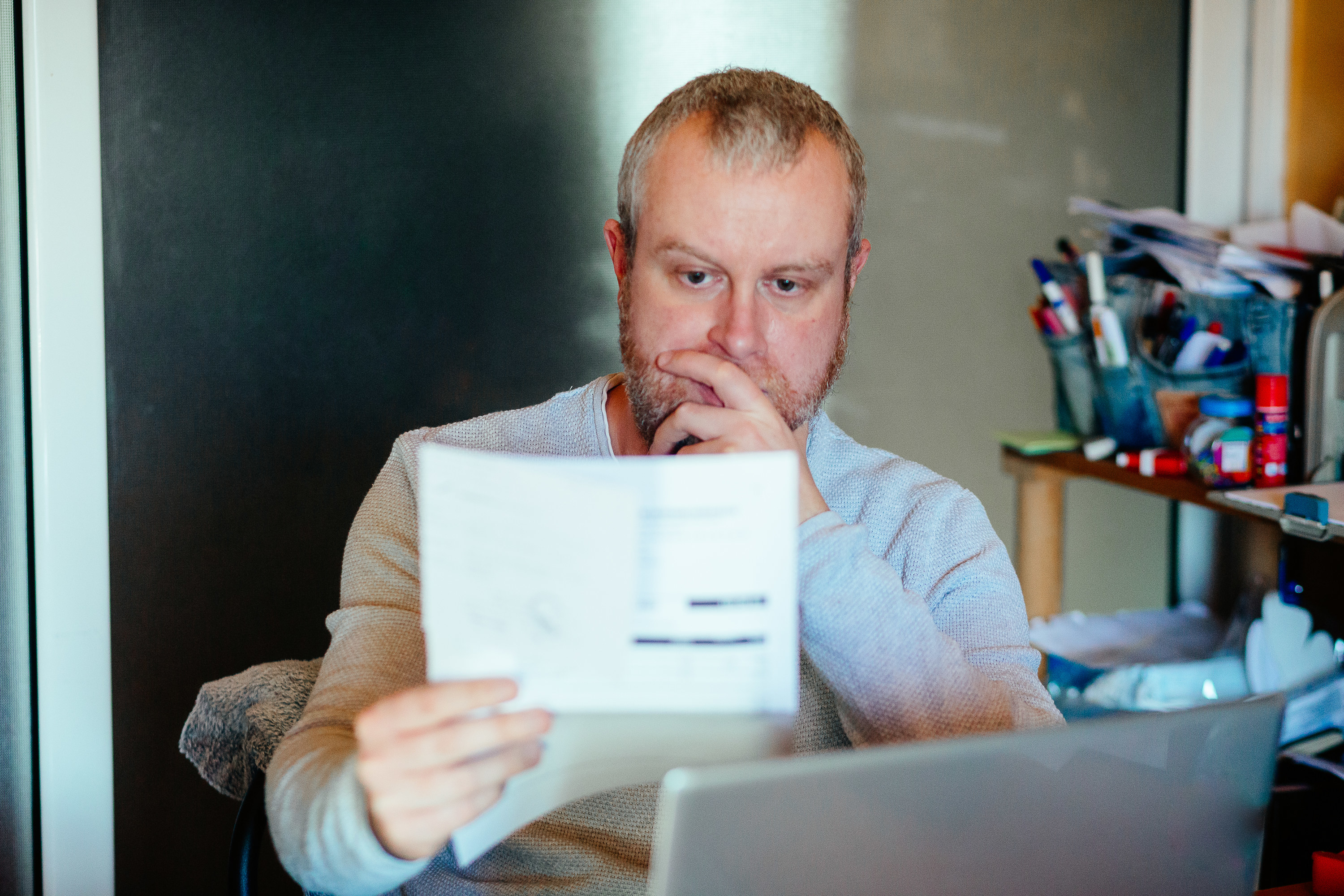 a man looking over paperwork