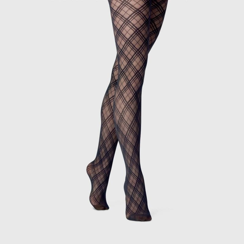 model wearing black sheer plaid patterned tights