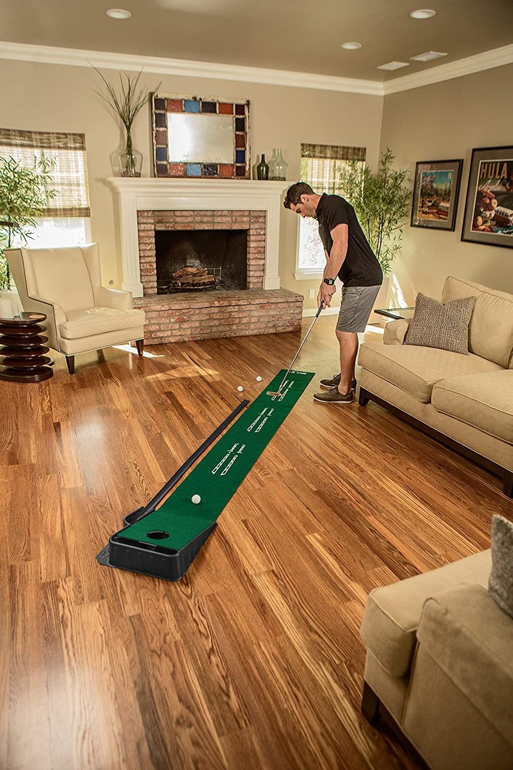 person in a living room using the indoor putt