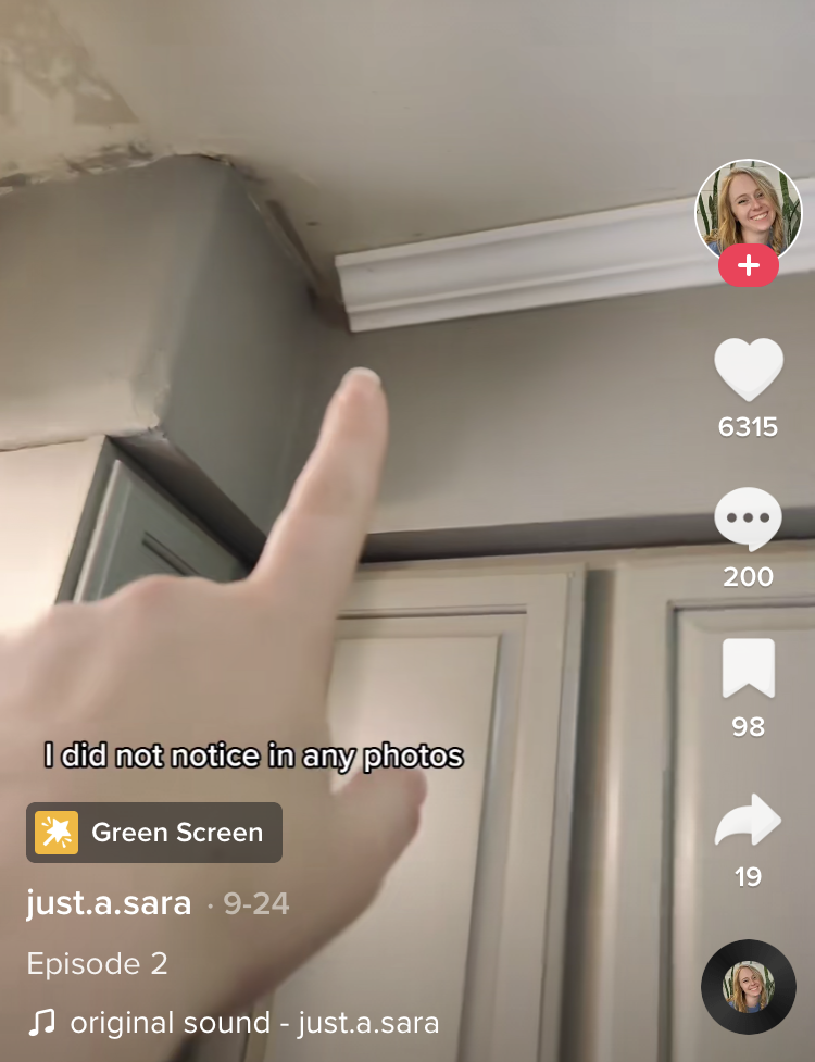 Sara pointing out the texture on her kitchen ceiling and the trim that doesn&#x27;t extend to the wall