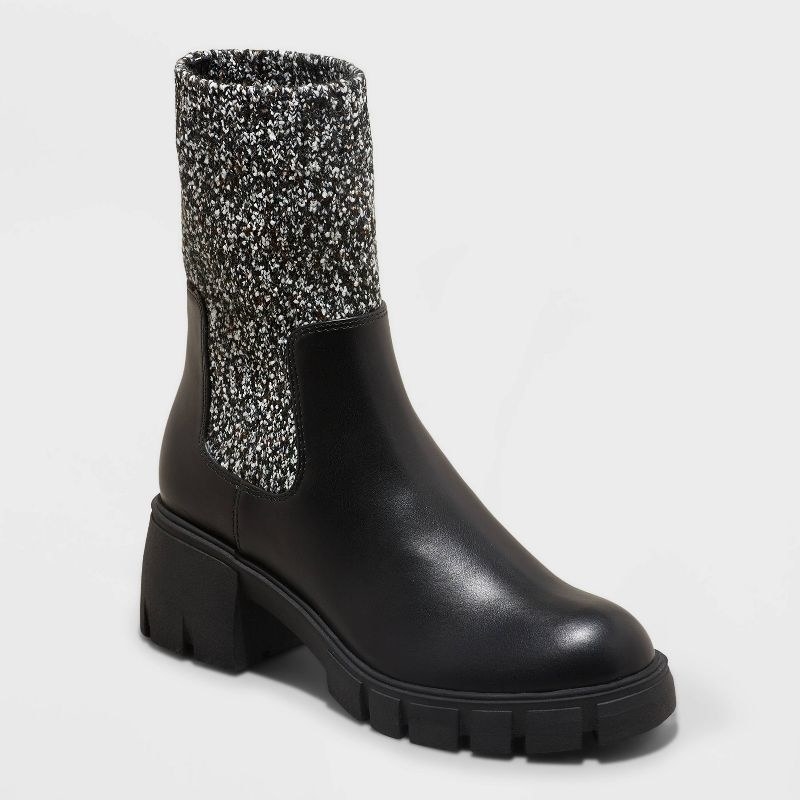 black chelsea boots with black and white speckled sock-like upper